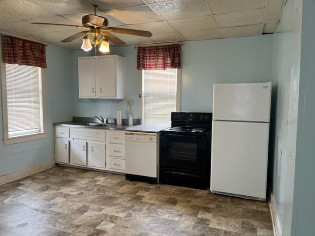 299 Reno Street Rochester, PA 15074 - Photo 1 of 12 a kitchen with a refrigerator and a stove top oven