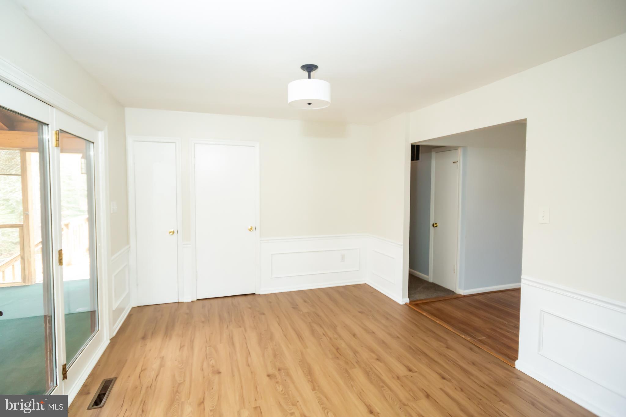 11623 Rivershore Drive Dunkirk, MD 20754 - Photo 12 of 49 a view of a room with wooden floor and white walls