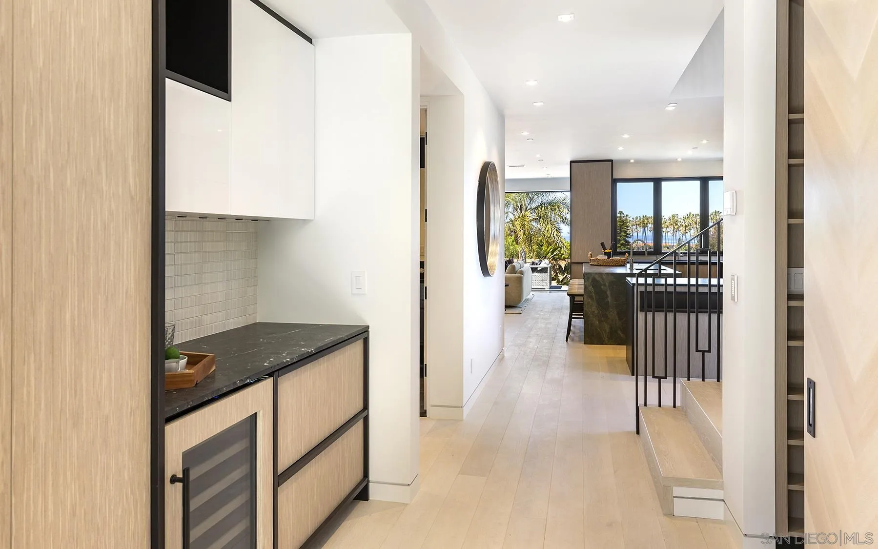 2045 Lowry Place La Jolla, CA 92037 - Photo 18 of 52 a hallway with a sink and cabinets