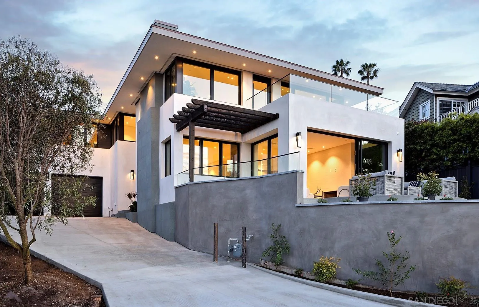 2045 Lowry Place La Jolla, CA 92037 - Photo 2 of 52 a front view of a house with a yard