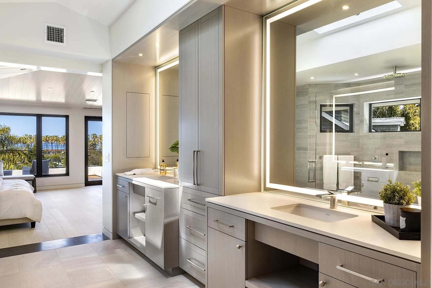 2045 Lowry Place La Jolla, CA 92037 - Photo 39 of 52 a bathroom with a sink and a large mirror