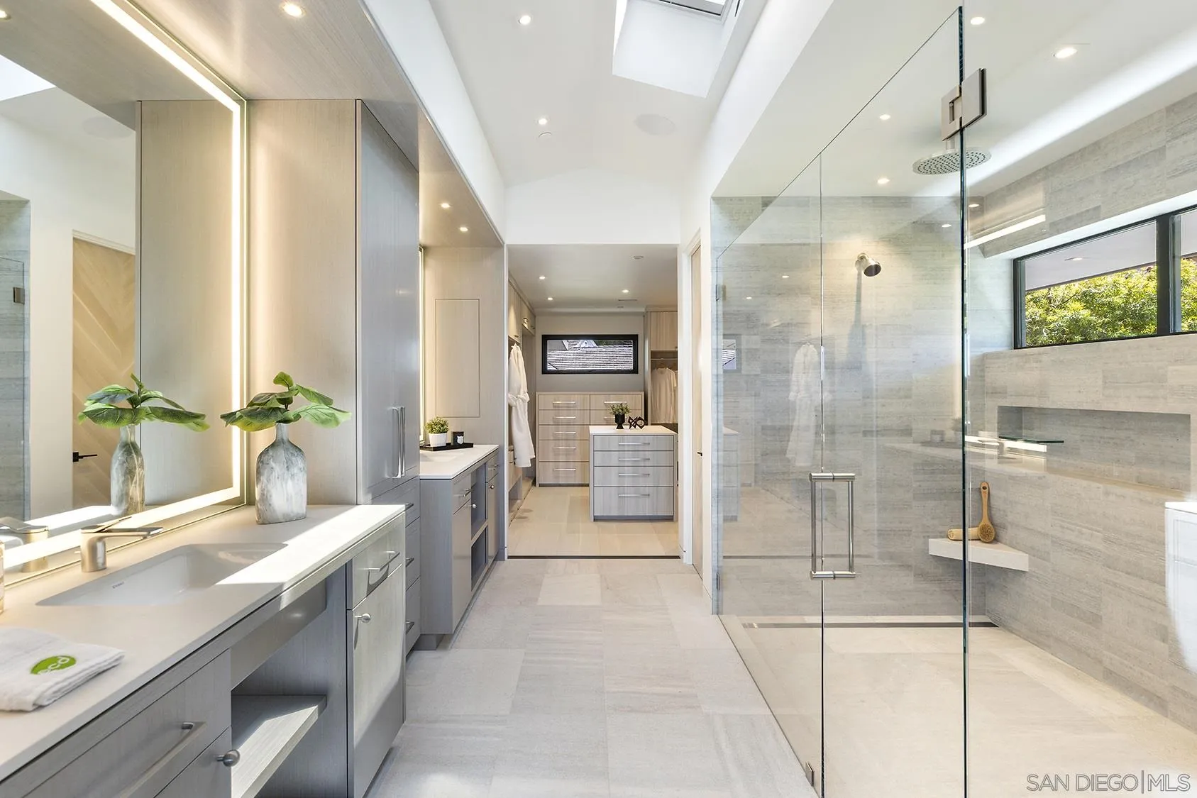 2045 Lowry Place La Jolla, CA 92037 - Photo 40 of 52 a bathroom with a double vanity sink toilet and shower