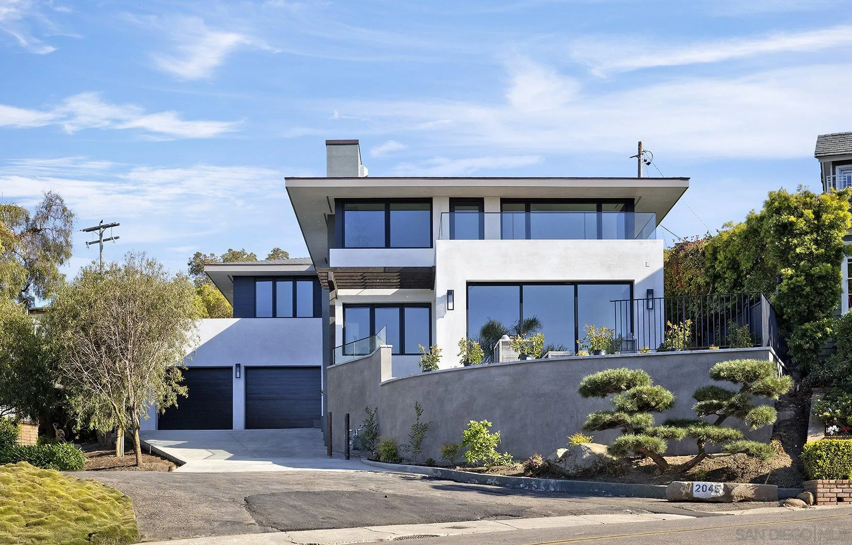 2045 Lowry Place La Jolla, CA 92037 - Photo 4 of 52 a front view of a house with a yard