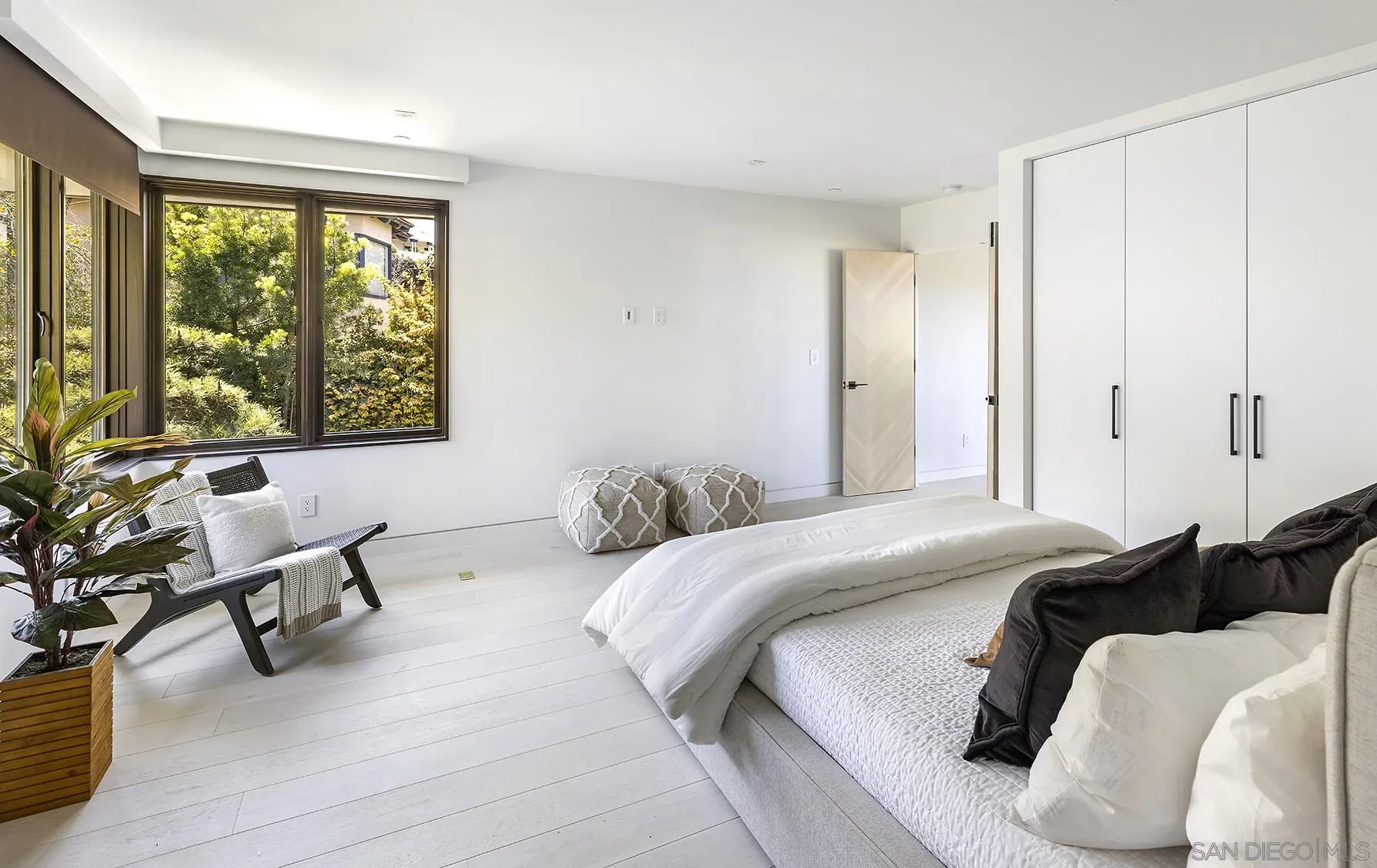 2045 Lowry Place La Jolla, CA 92037 - Photo 43 of 52 a bedroom with a bed and a large window