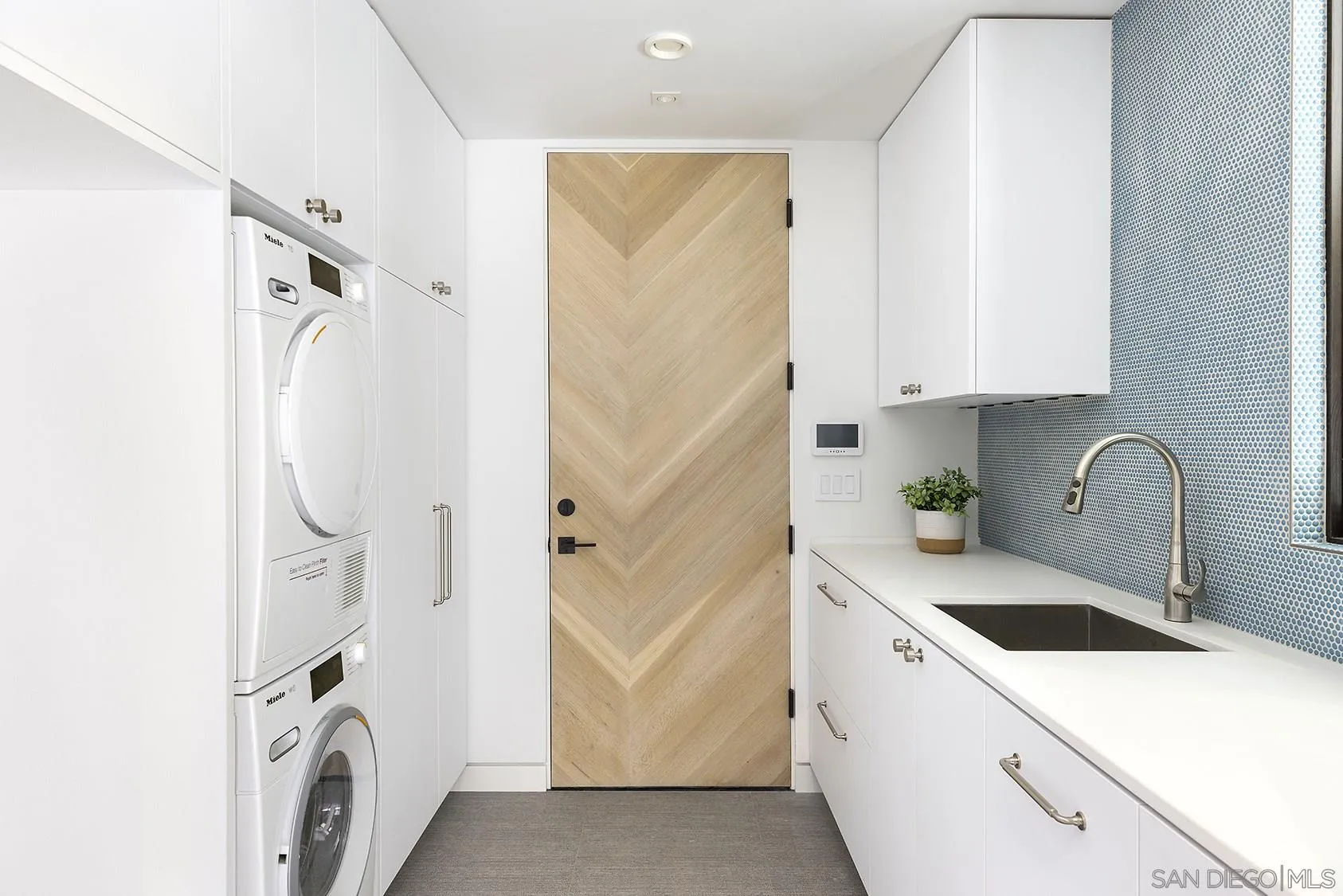 2045 Lowry Place La Jolla, CA 92037 - Photo 50 of 52 a bathroom with a sink a washer and dryer
