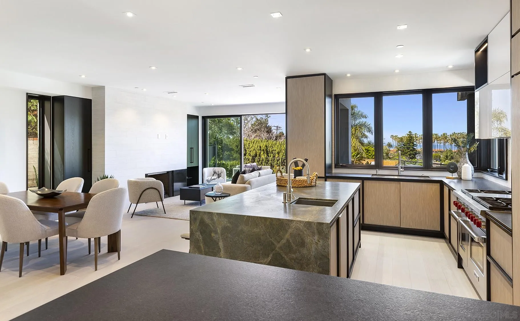 2045 Lowry Place La Jolla, CA 92037 - Photo 10 of 52 a view of kitchen with stainless steel appliances granite countertop sink stove and wooden cabinets