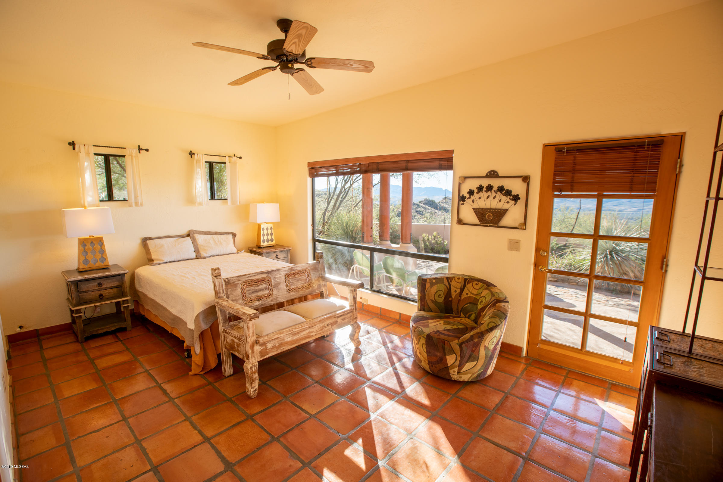 1551 Vía San Cayetano Rio Rico, AZ 85648 - Photo 24 of 29 a bedroom with a bed and balcony