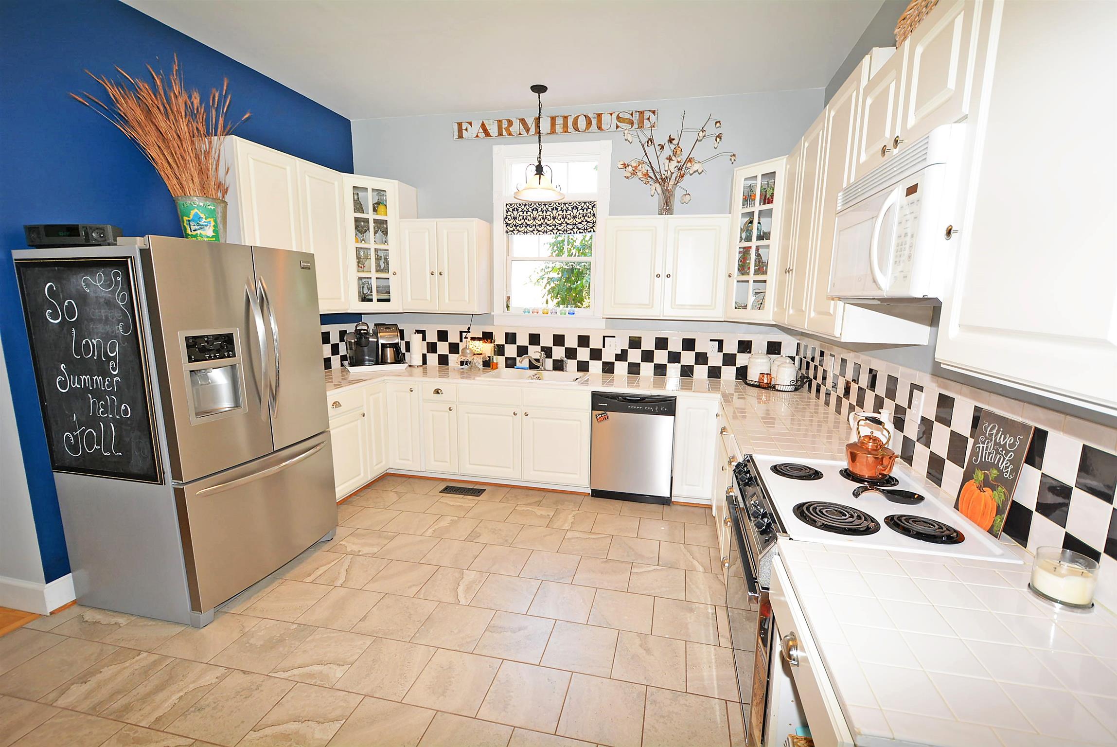 745 Balthrop Road Chapmansboro, TN 37035 - Photo 5 of 14 Large open kitchen with stunning white cabinets, new hardware, and new tile floors!