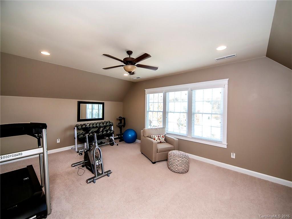 664 Revival Row, Unit 1077 Fort Mill, SC 29708 - Photo 22 of 24 a view of a livingroom with furniture and windows