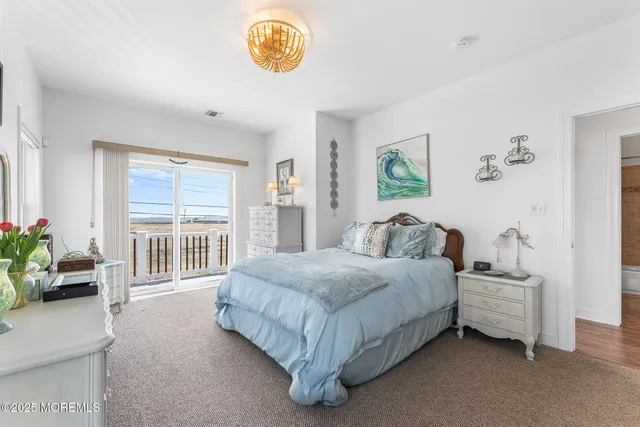 a spacious bedroom with a bed and a window