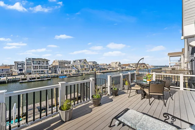 a view of a balcony with wooden benches