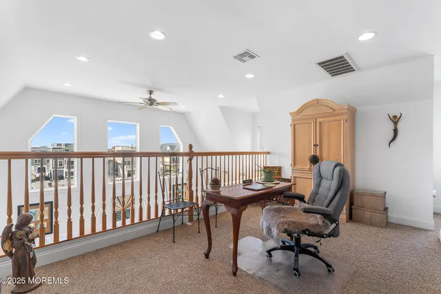 a workspace with furniture and a window