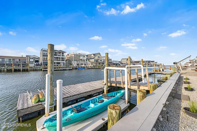 a view of a balcony with two chairs and a table