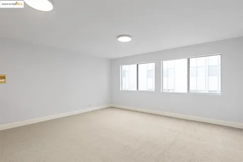 a white refrigerator freezer and a stove sitting inside of a kitchen