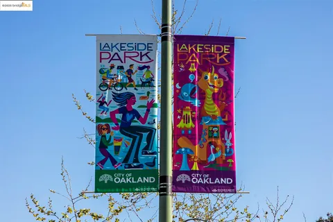 a view of residential houses with water and city view