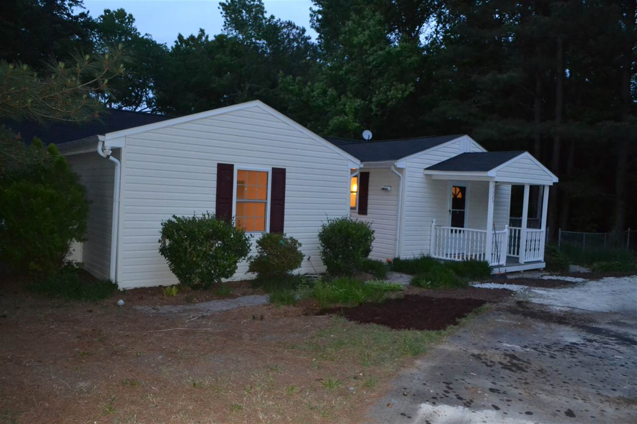 4623 Bragg Road Durham, NC 27704 - Photo 22 of 25 Home sits far back off road, sit on your covered porch and enjoy nature, just over an acre lot giving you lots of room for gardens, pets, outdoor living and privacy. Covered Porch to Enjoy