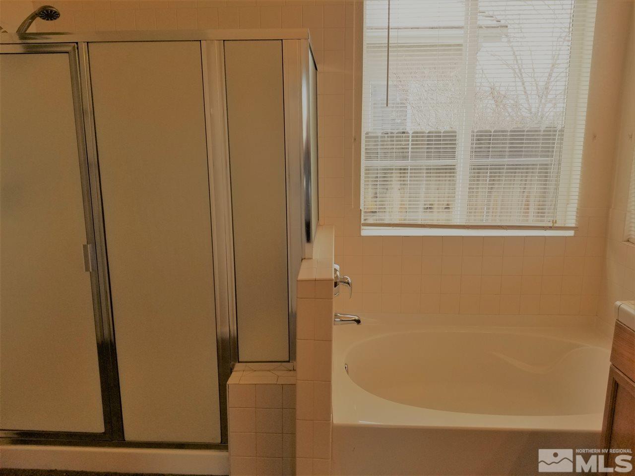 9625 Glen Ridge Drive Reno, NV 89521 - Photo 16 of 23 a bathroom with a shower
