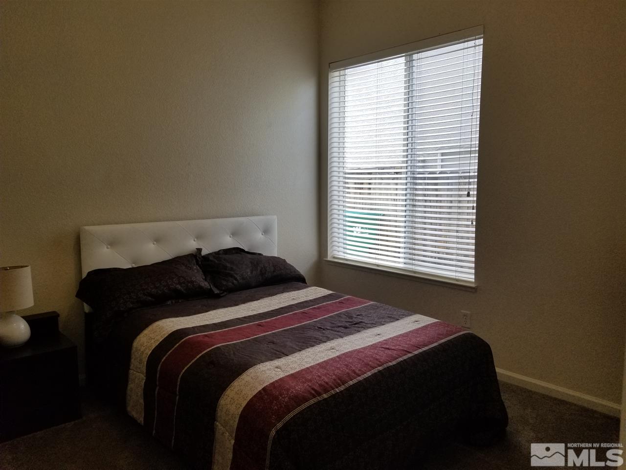 9625 Glen Ridge Drive Reno, NV 89521 - Photo 19 of 23 a bedroom with a bed and a window