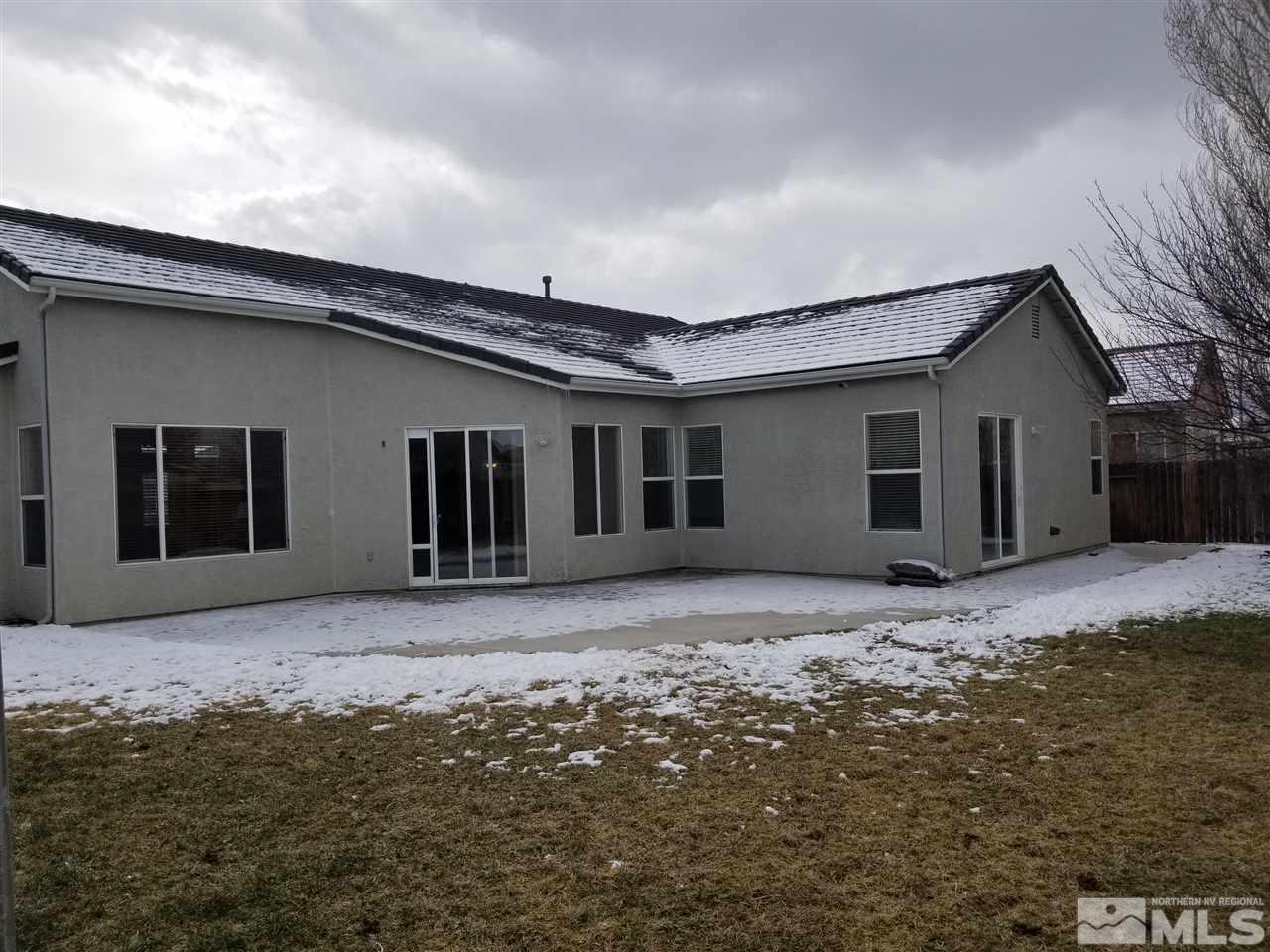 9625 Glen Ridge Drive Reno, NV 89521 - Photo 21 of 23 a front view of a house with a yard