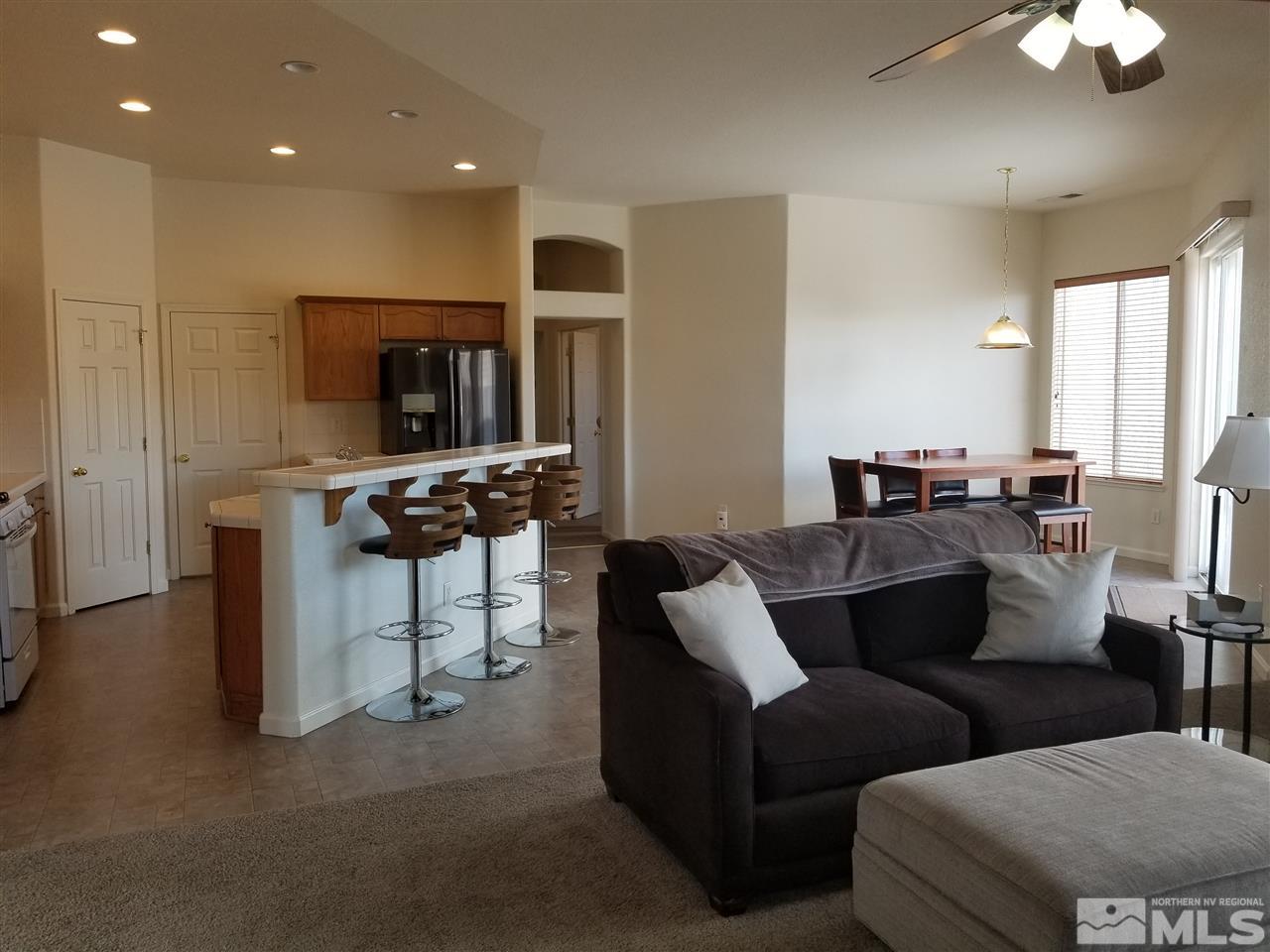 9625 Glen Ridge Drive Reno, NV 89521 - Photo 8 of 23 a living room with furniture and a flat screen tv