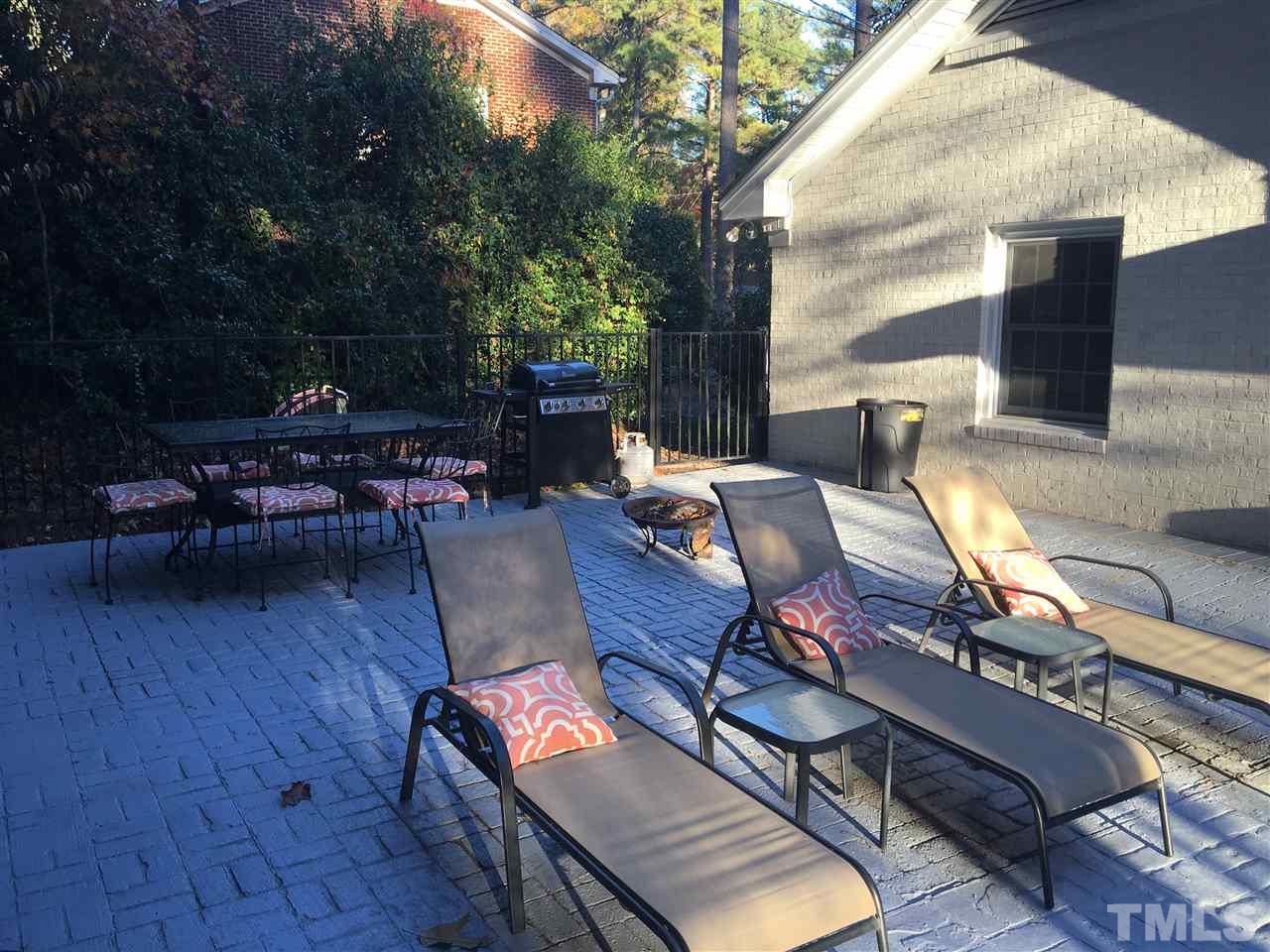 1101 Ivy Lane Raleigh, NC 27609 - Photo 22 of 25 Patio has been extended, stamped to match existing pool deck and stained to match. Fire up the grill and fire pit and enjoy!