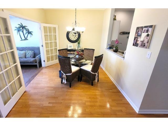 427 Colonial Trace Drive, Unit 1E Longs, SC 29568 - Photo 15 of 35 Dining area with hardwood / wood-style flooring, a