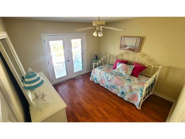 427 Colonial Trace Drive, Unit 1E Longs, SC 29568 - Photo 27 of 35 Bedroom with ceiling fan, dark hardwood / wood-sty