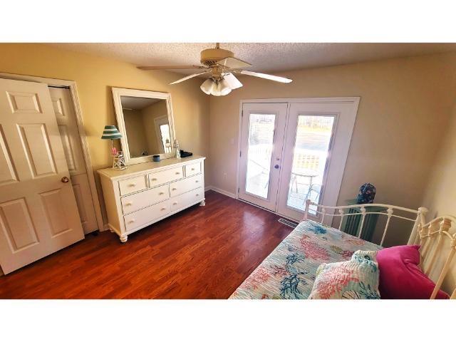 427 Colonial Trace Drive, Unit 1E Longs, SC 29568 - Photo 28 of 35 Bedroom featuring french doors, ceiling fan, dark