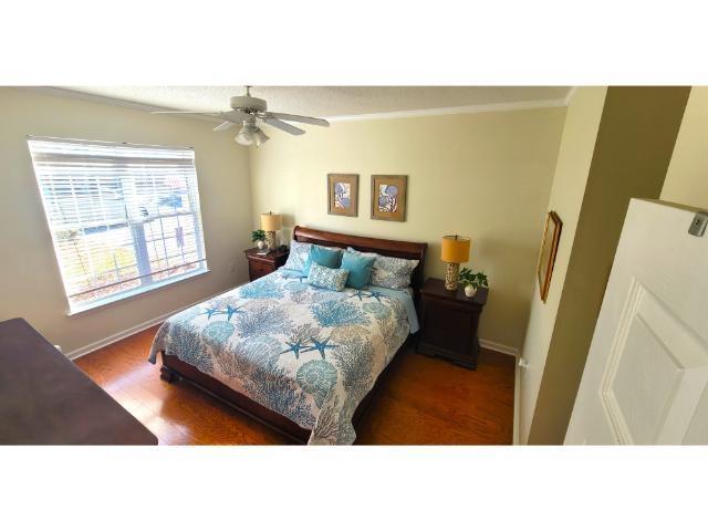 427 Colonial Trace Drive, Unit 1E Longs, SC 29568 - Photo 3 of 35 Bedroom featuring dark hardwood / wood-style floor