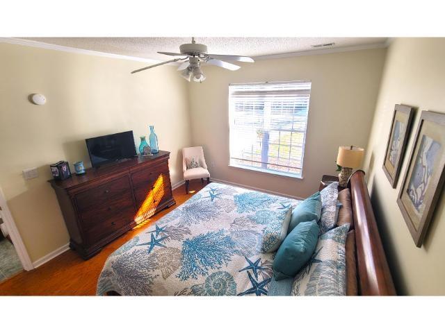 427 Colonial Trace Drive, Unit 1E Longs, SC 29568 - Photo 4 of 35 Bedroom featuring hardwood / wood-style flooring a