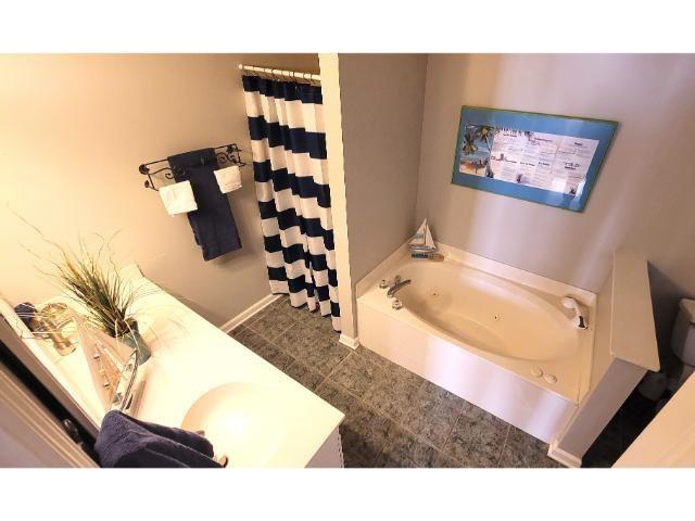 427 Colonial Trace Drive, Unit 1E Longs, SC 29568 - Photo 7 of 35 Bathroom with tile patterned flooring and a washtu