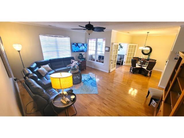 427 Colonial Trace Drive, Unit 1E Longs, SC 29568 - Photo 9 of 35 Living room featuring hardwood / wood-style floors