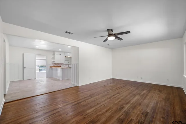 a view of a kitchen with wooden floor and a kitchen view