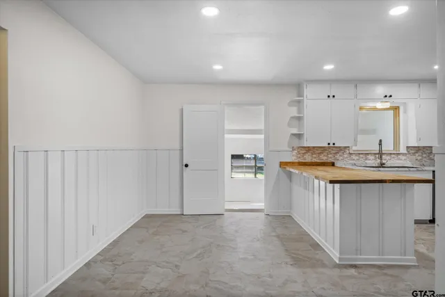 a bathroom with a sink a mirror and a bathtub