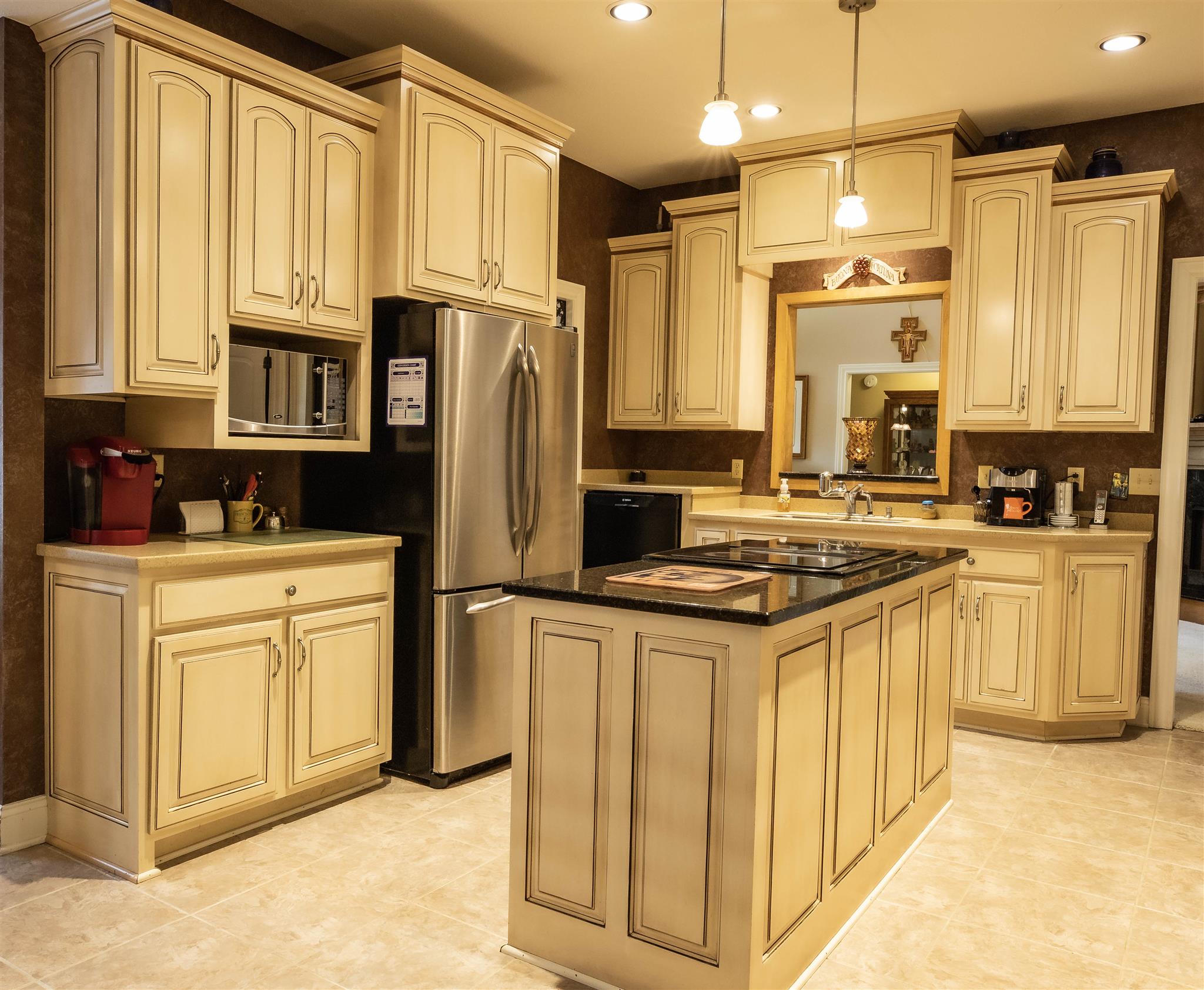 210 Airport Road Waverly, TN 37185 - Photo 11 of 30 This is an awesome kitchen with ample space for a crowd! Tall cabinets provide added storage space. Counters are quartz and Corian. Drawers slide out for easy access.