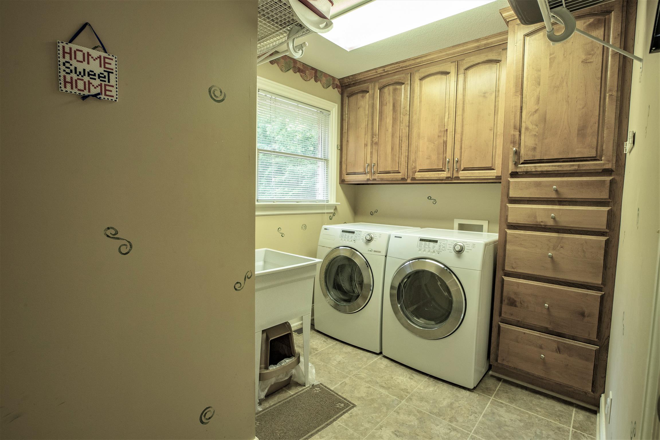 210 Airport Road Waverly, TN 37185 - Photo 24 of 30 The laundry has plenty of space to work, ample cabinets and drawers and a stationery tub.