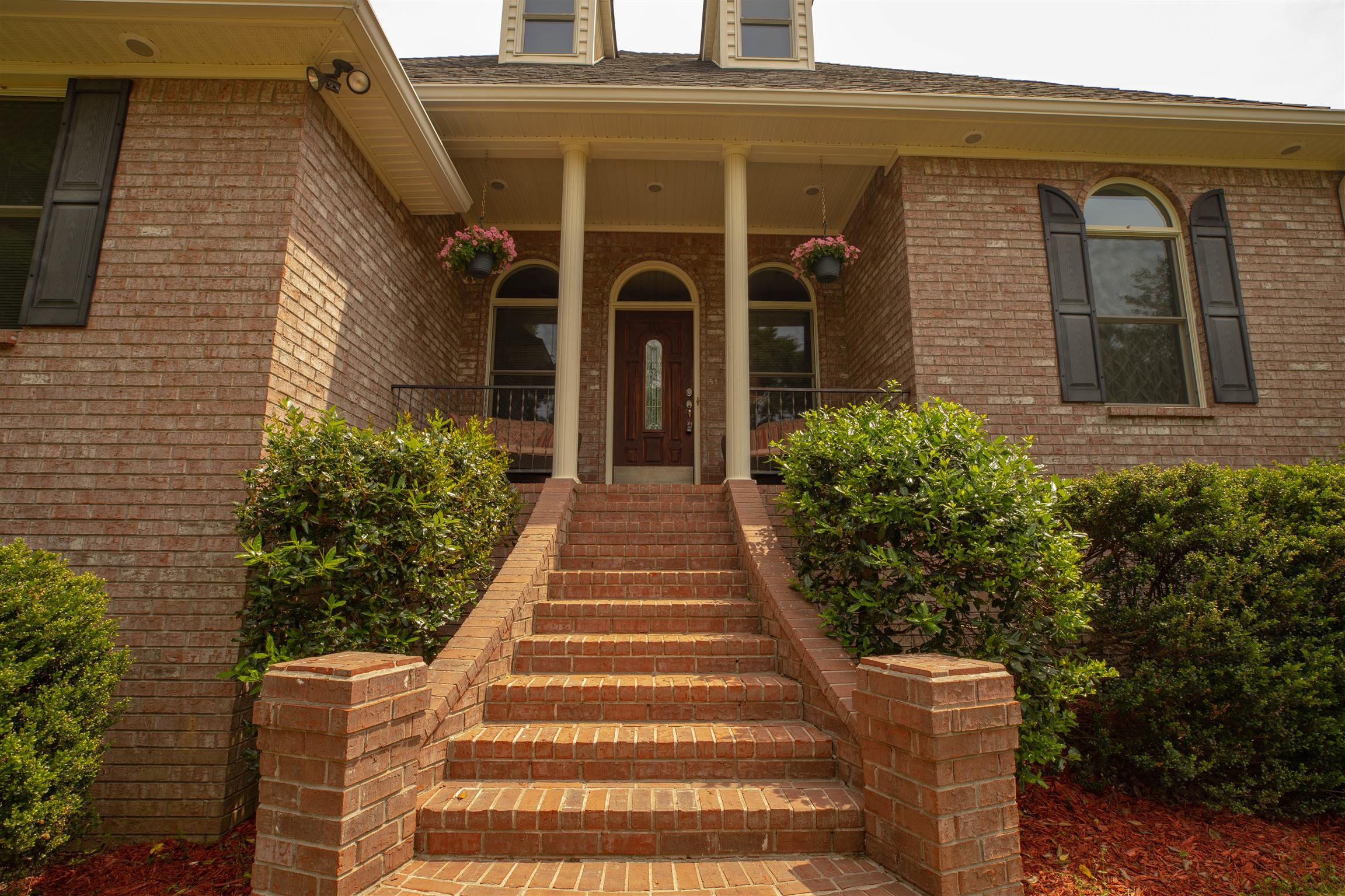 The home is beautifully landscaped. 