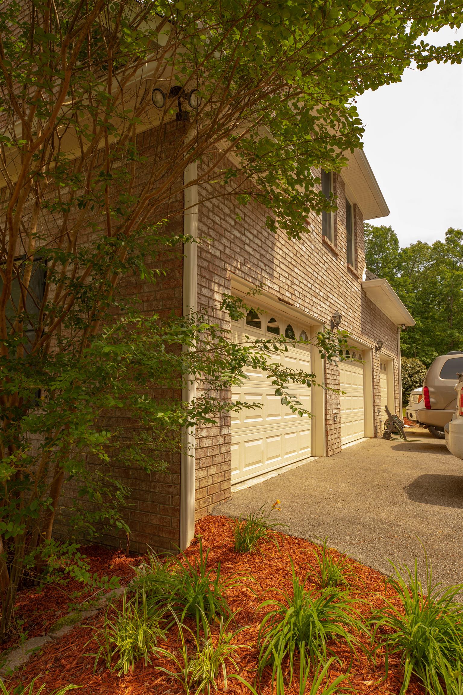The 3 car attached garage is heated and cooled. Sellers replaced the garage doors 6 years ago. Interior access to the storm cellar is through the garage. 