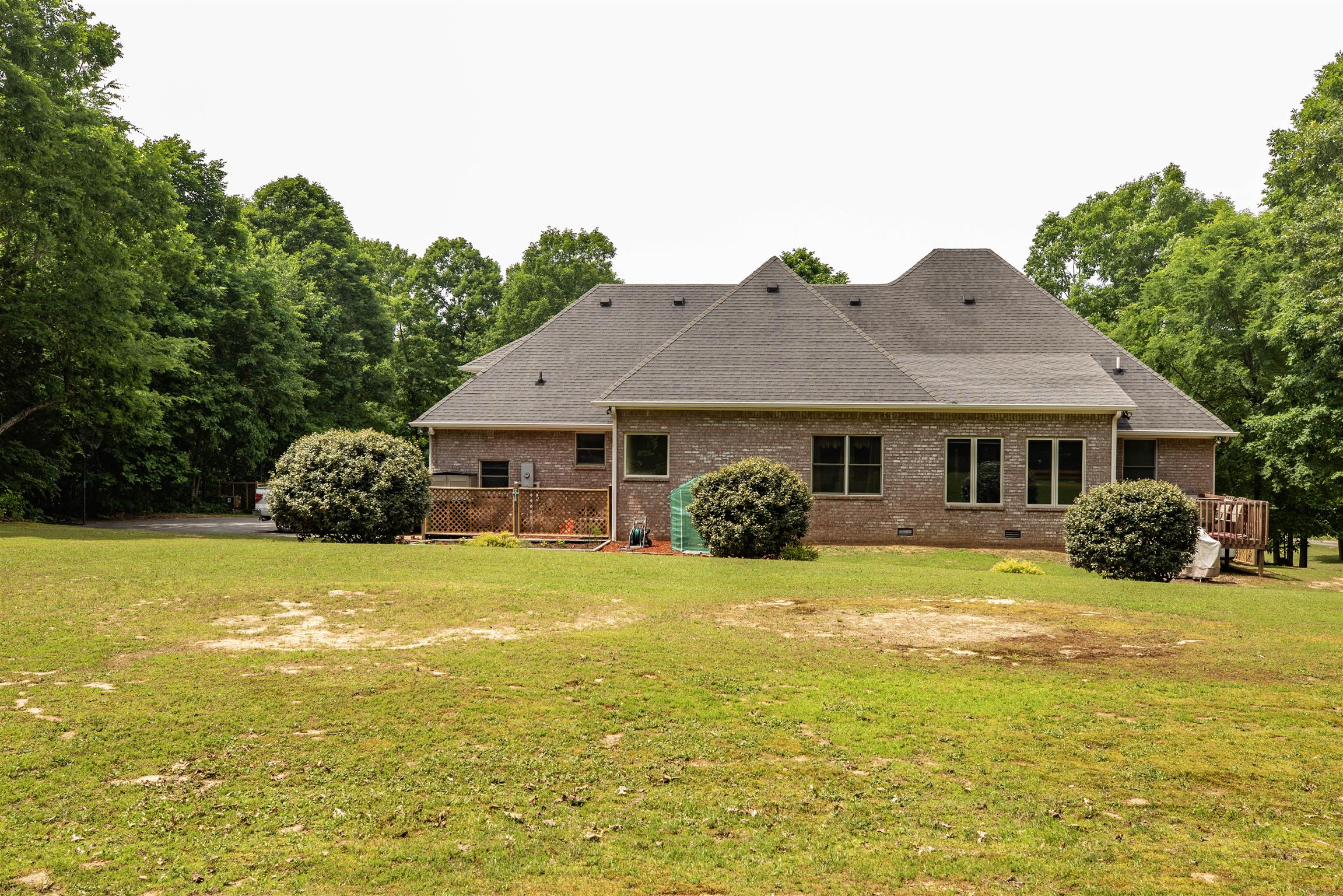 This is a rear view of the home. The home has two HVAC units, a Rudd 2 ton for upstairs and a 5 ton for downstairs, serviced by Hiller. 