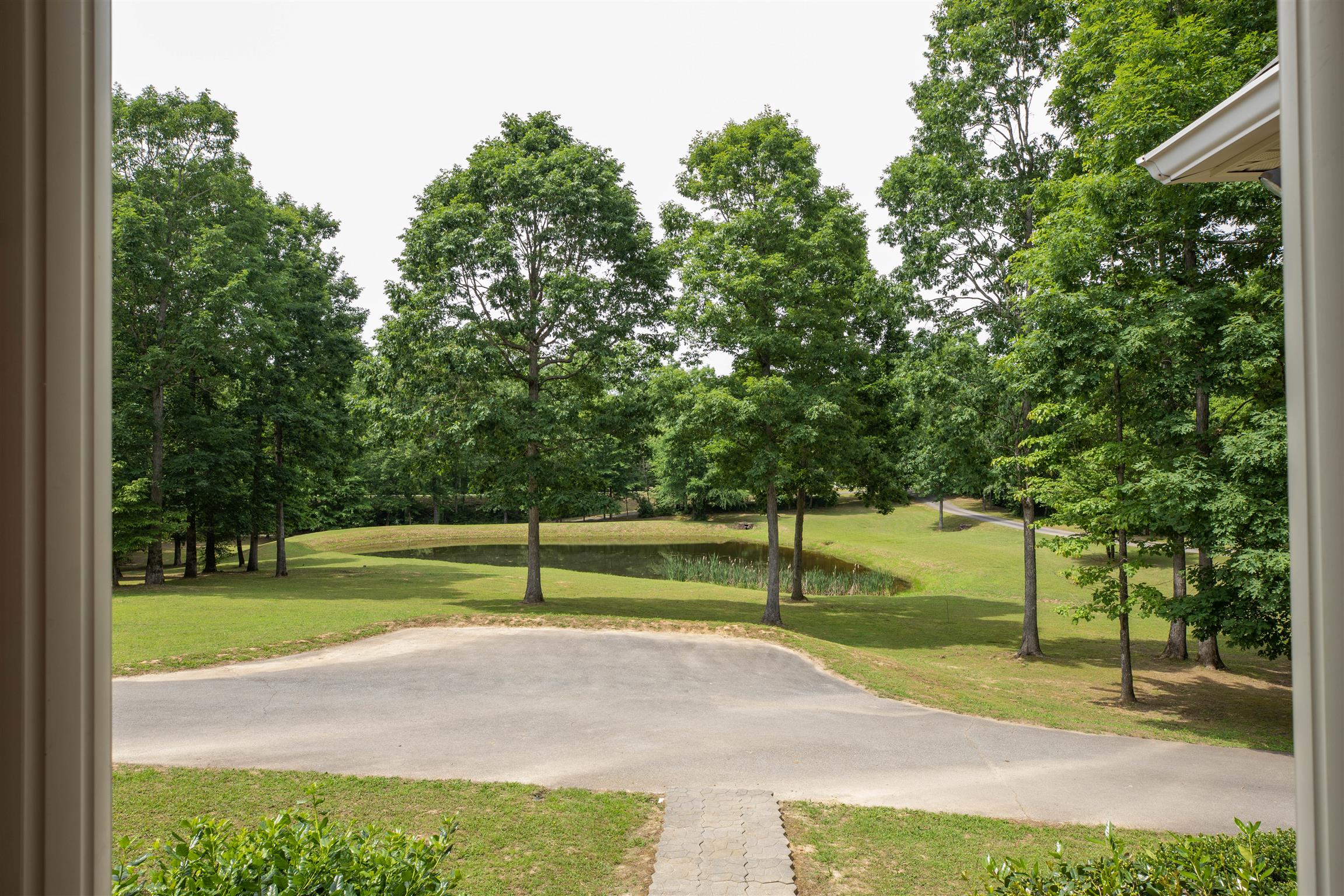 Relax on the front porch and enjoy the scenery. Open parking is available in front for the convenience of  visitors. If you love to walk, the city's walking trail lies just outside the property. 