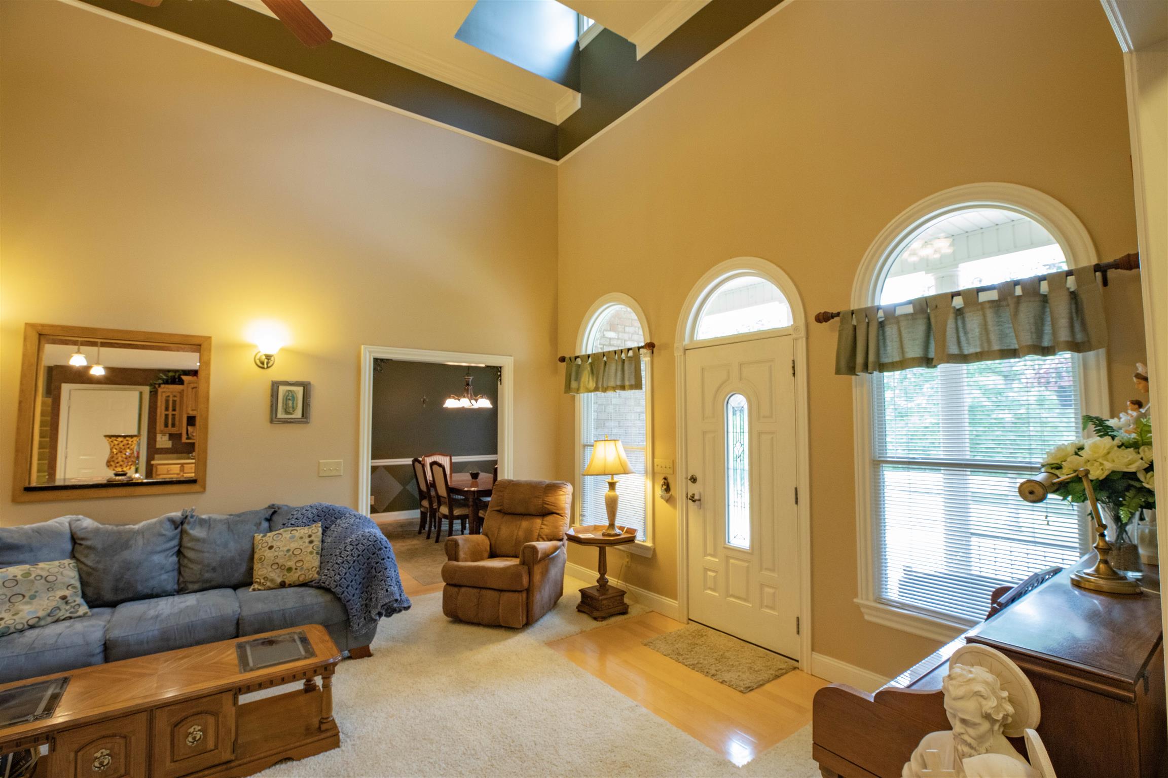 210 Airport Road Waverly, TN 37185 - Photo 9 of 30 Plenty of natural light is welcome with skylights and arched windows. The high ceilings make this home feel especially comfortable and spacious.