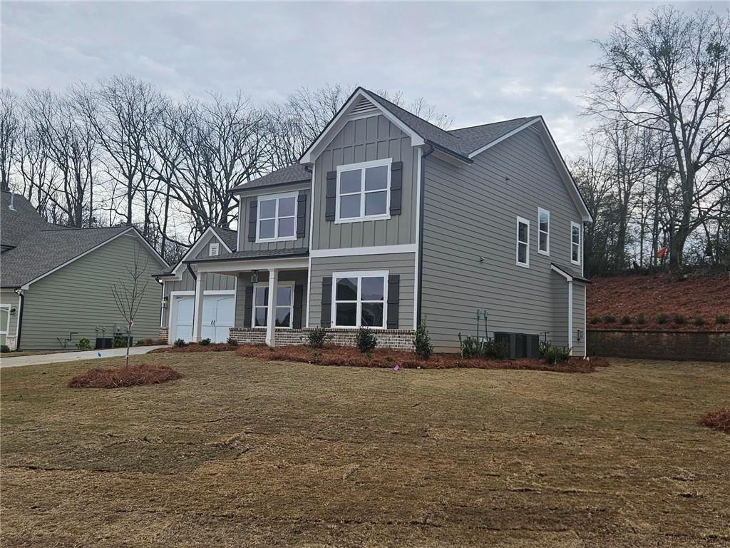 596 Calgary Downs Drive Winder, GA 30680 - Photo 3 of 3 a front view of a house with a yard