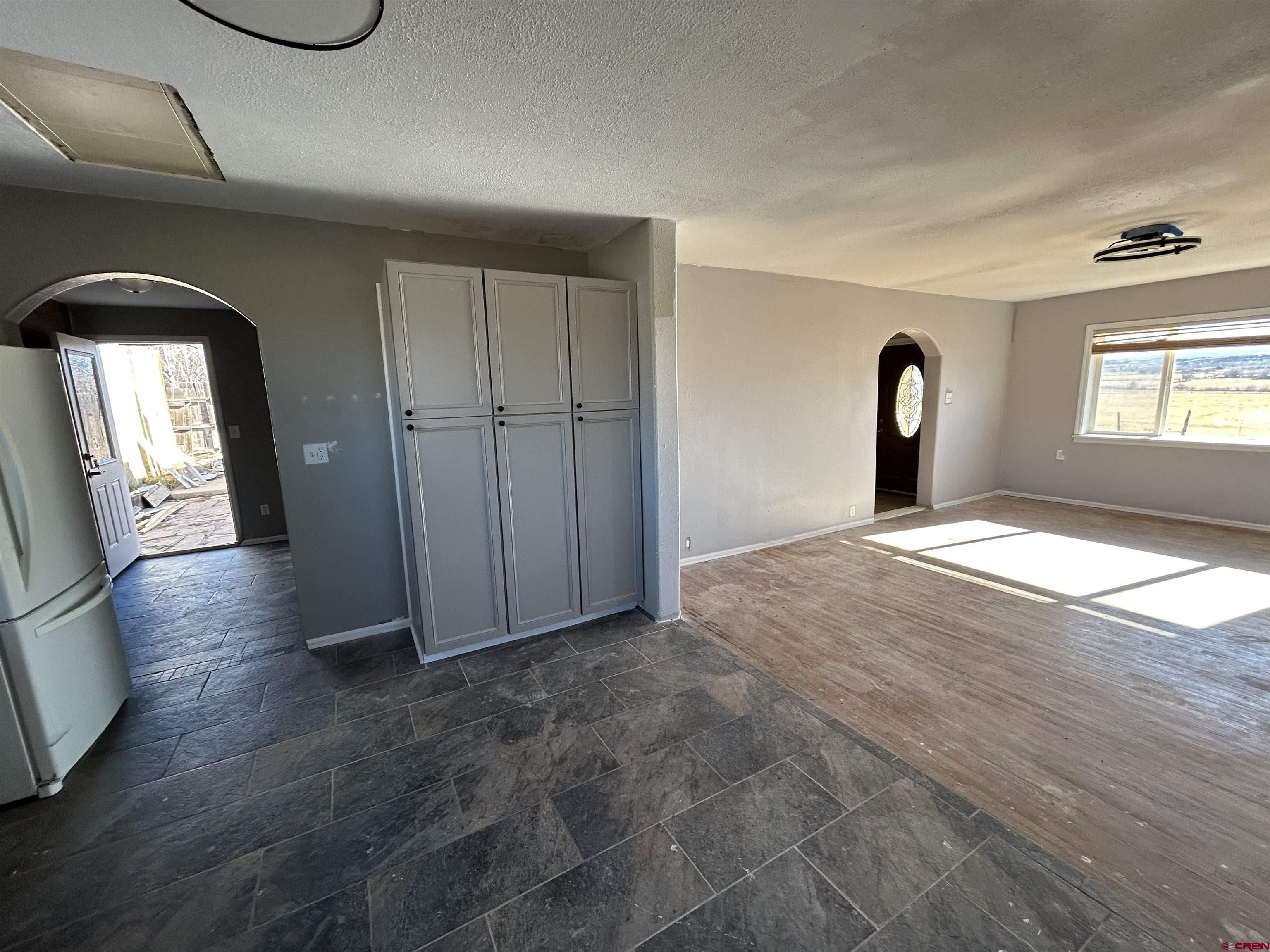 27643 BB Road Nucla, CO 81424 - Photo 5 of 21 wooden floor in an empty room with a window