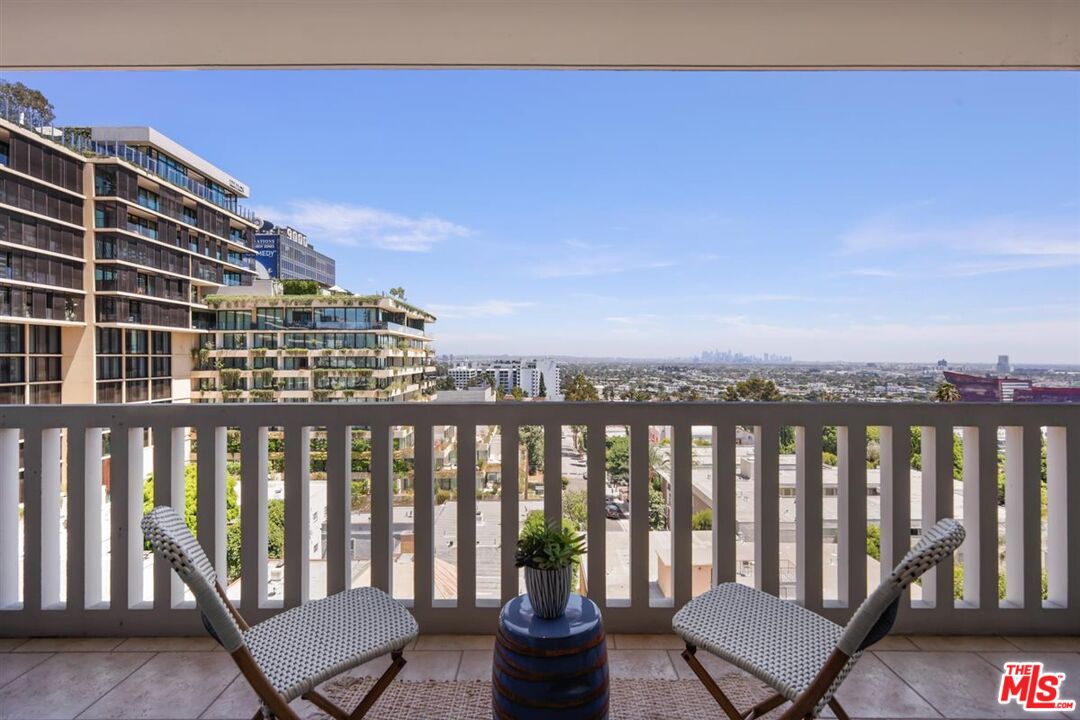 999 North Doheny Drive, Unit 806 West Hollywood, CA 90069 - Photo 7 of 11 a view of a balcony with chairs