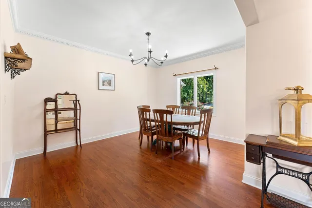 a living room with furniture a rug and a chandelier