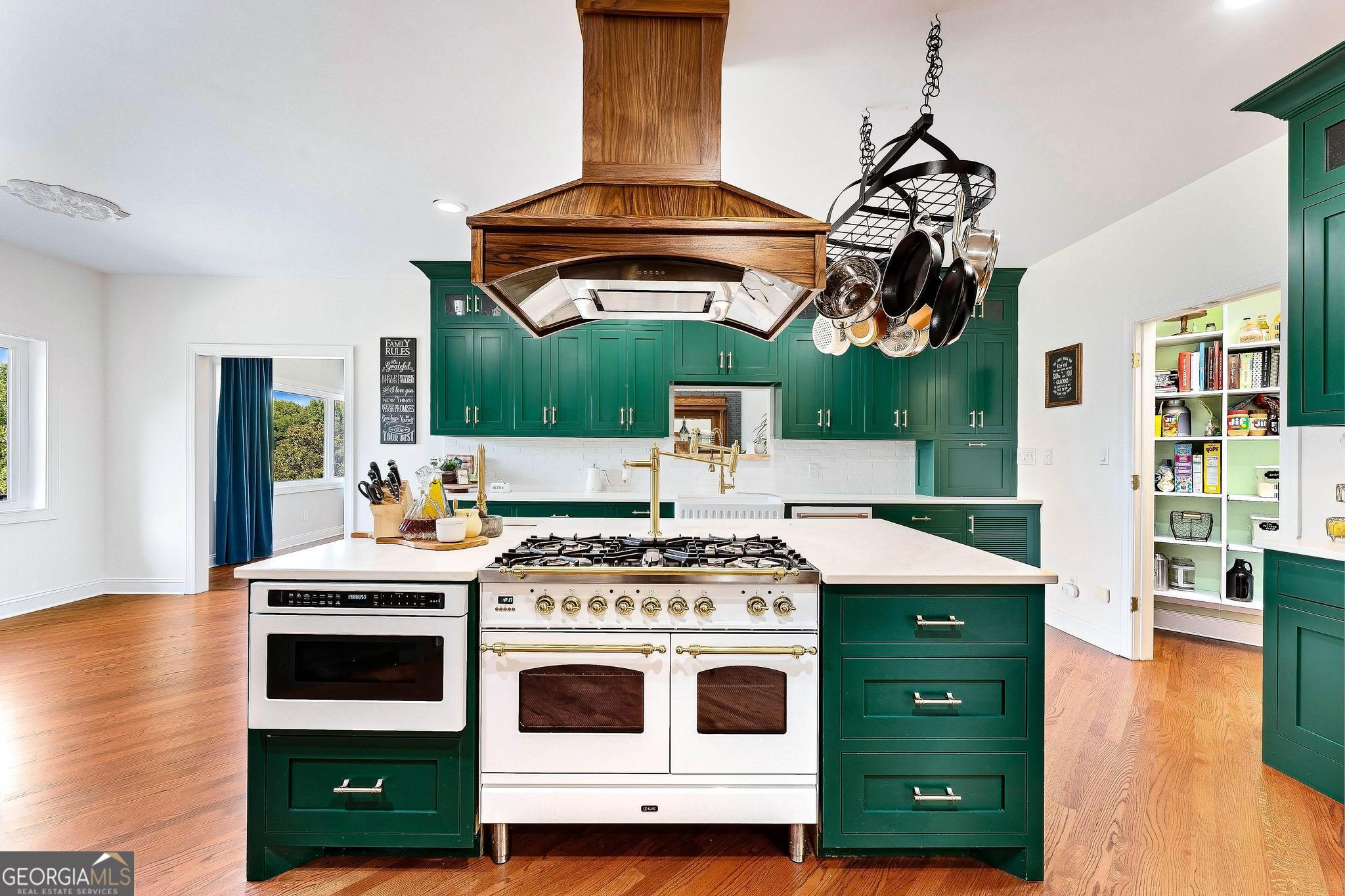 366 Curt Bailey Road Hartwell, GA 30643 - Photo 18 of 83 a stove top oven sitting inside of a kitchen
