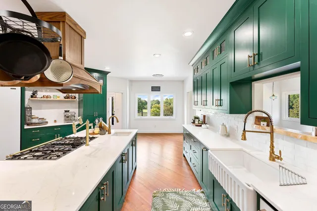 a spacious bathroom with a tub sink and mirror