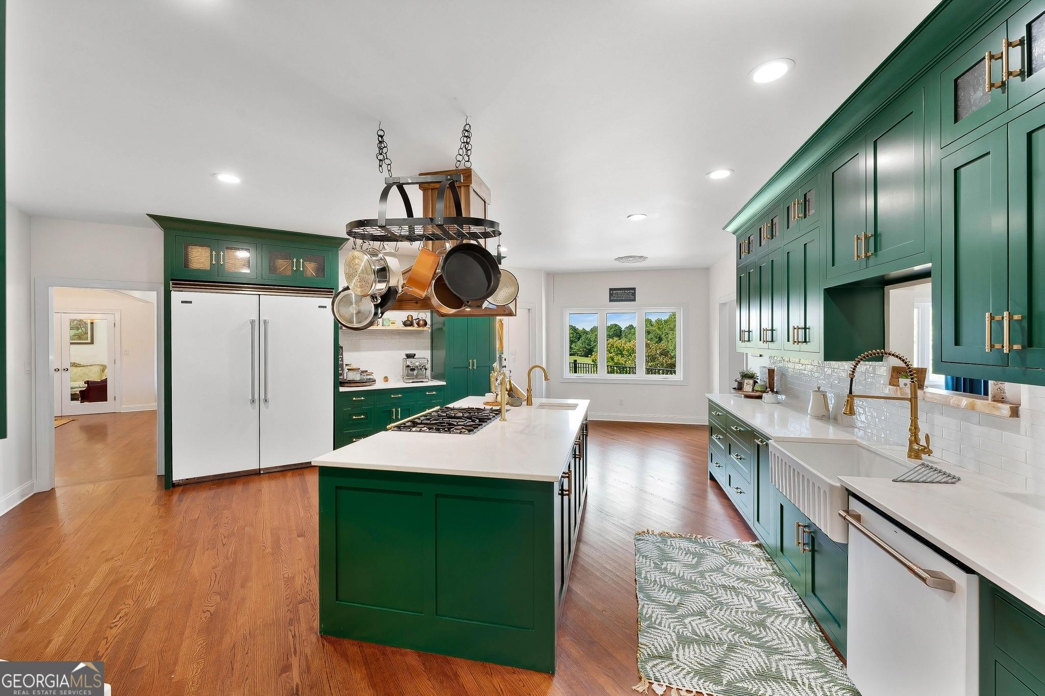 366 Curt Bailey Road Hartwell, GA 30643 - Photo 20 of 83 a large kitchen with kitchen island a large counter top space a sink stainless steel appliances and cabinets