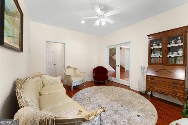 a view of a hallway with wooden floor