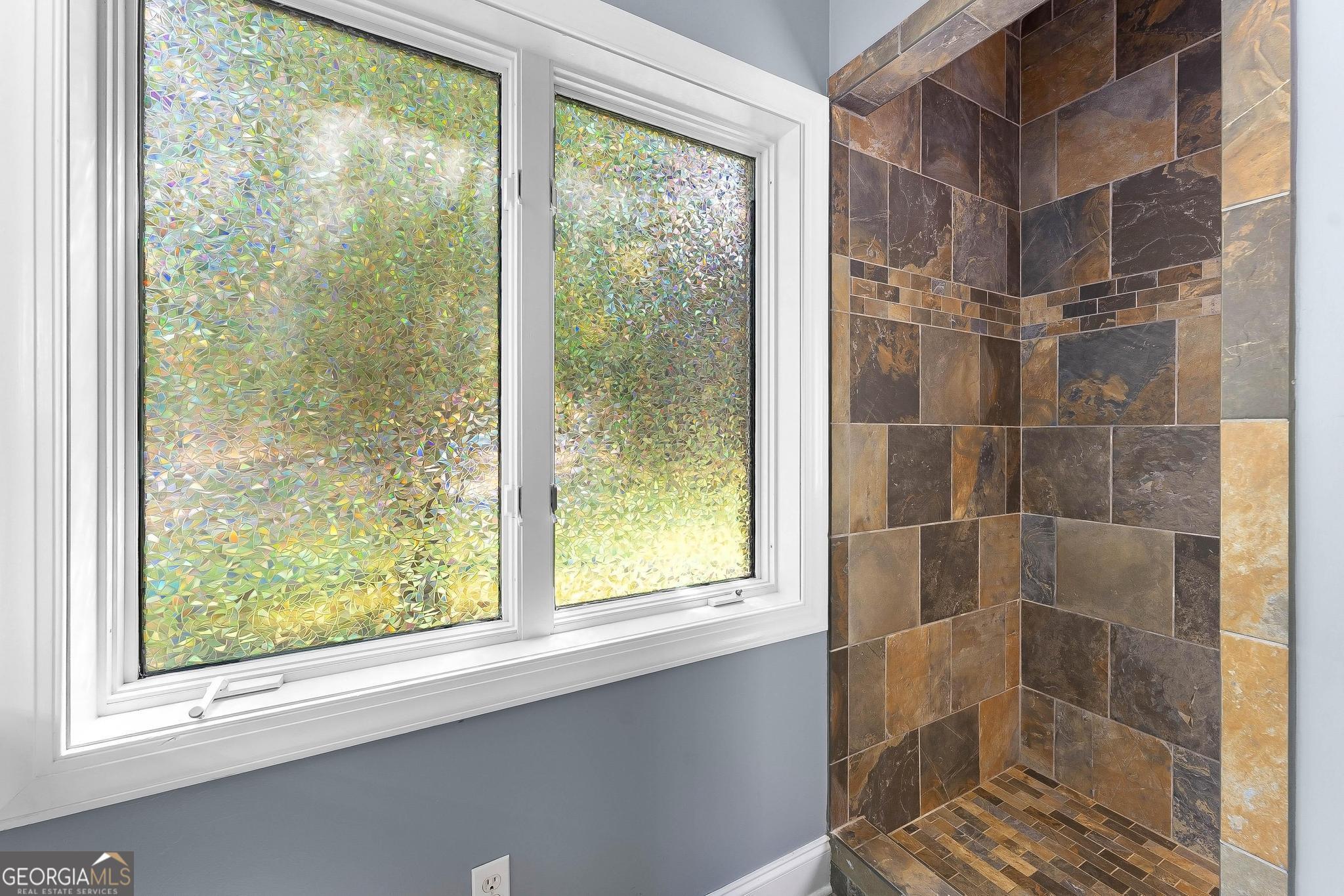 366 Curt Bailey Road Hartwell, GA 30643 - Photo 29 of 83 a bathroom with a glass shower door